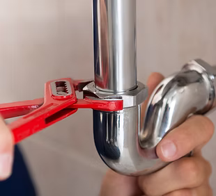 Plumber Fixing Pipes